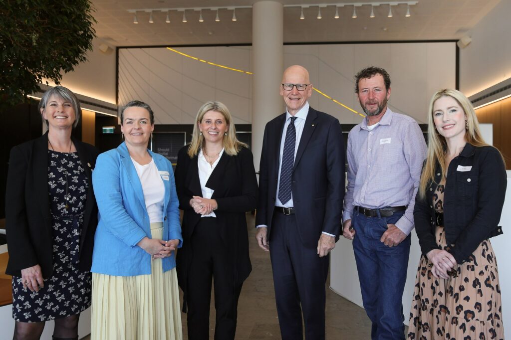 CEOs of mental health prevention services stand at an event hosted by Future generation global